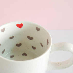 fair trade ceramic cup with hand painted hearts inside